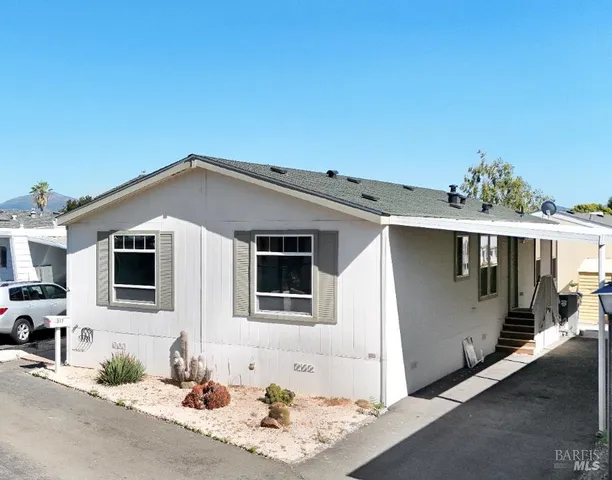 a front view of a house with a garage