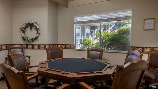 a blue chair sitting on a table in front of a window