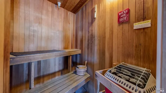 a bath room with a table and a chair