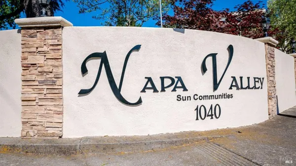 a bathroom with a shower curtain and a sink