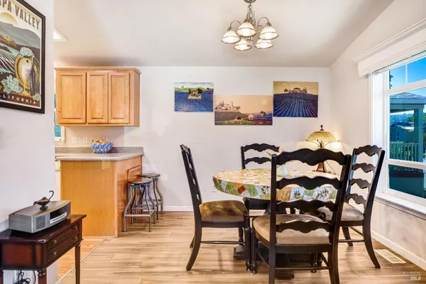 a dining room with furniture and window