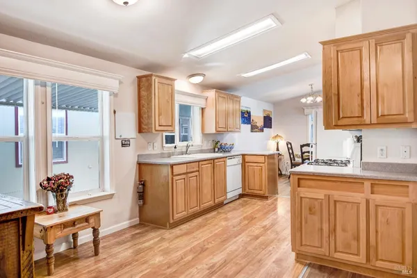 a kitchen with sink a cabinets and window
