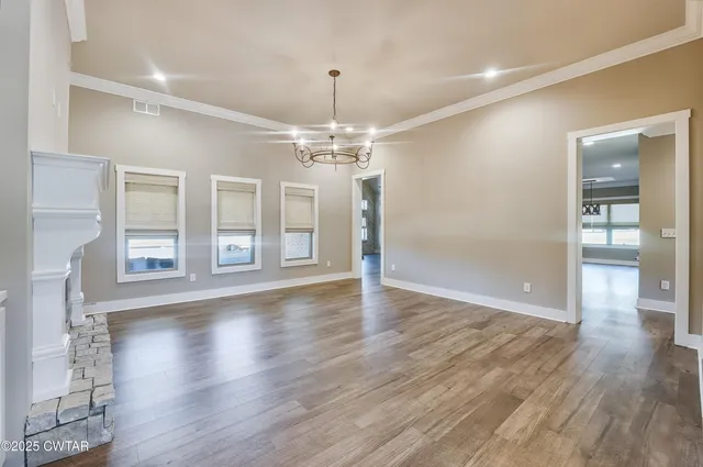a view of a livingroom with wooden floor