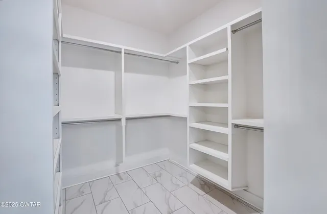 a view of an empty walk in closet
