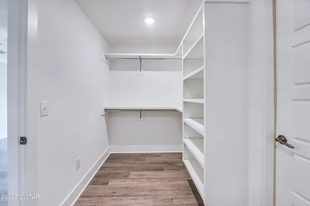 a view of an empty walk in closet