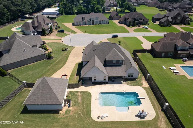 an aerial view of a house with a garden