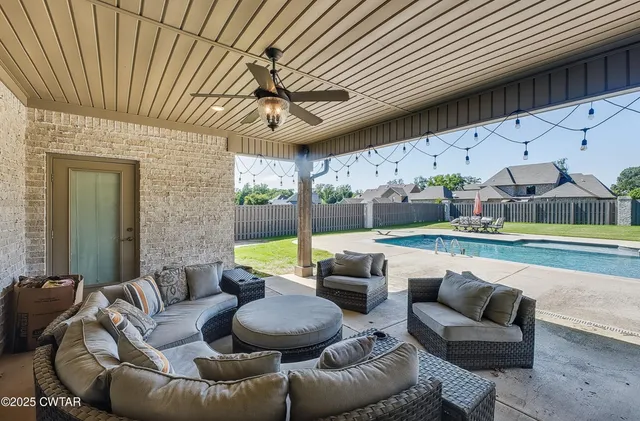 a outdoor living space with furniture and garden view