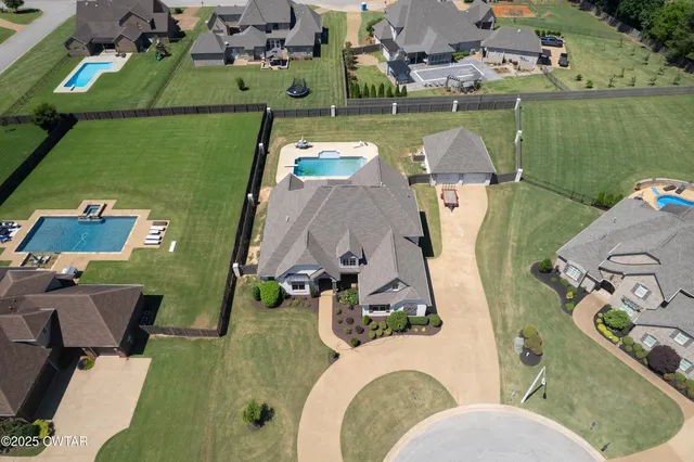an aerial view of a house with a garden