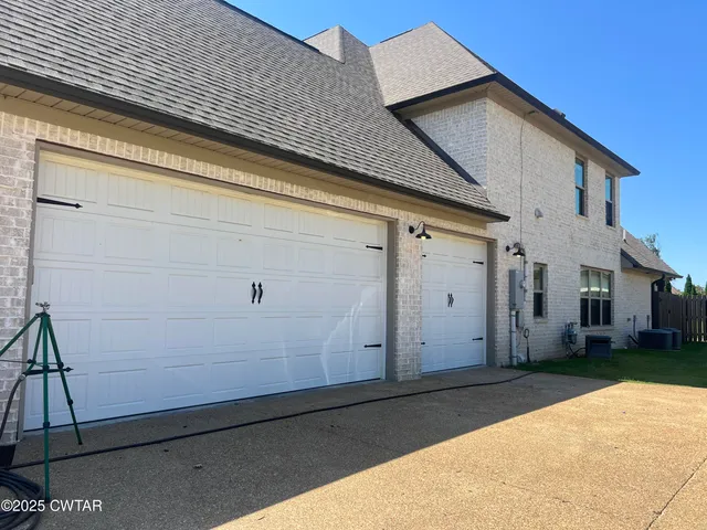 a front view of a house with garage