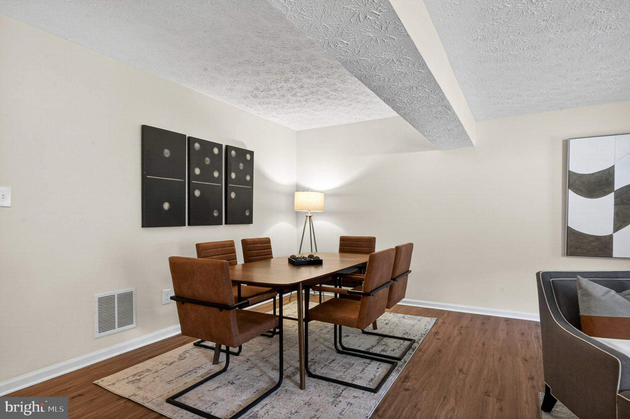 9129 Blarney Stone Drive Springfield, VA 22152 - Photo 26 of 34 Modern dining space with stylish decor.