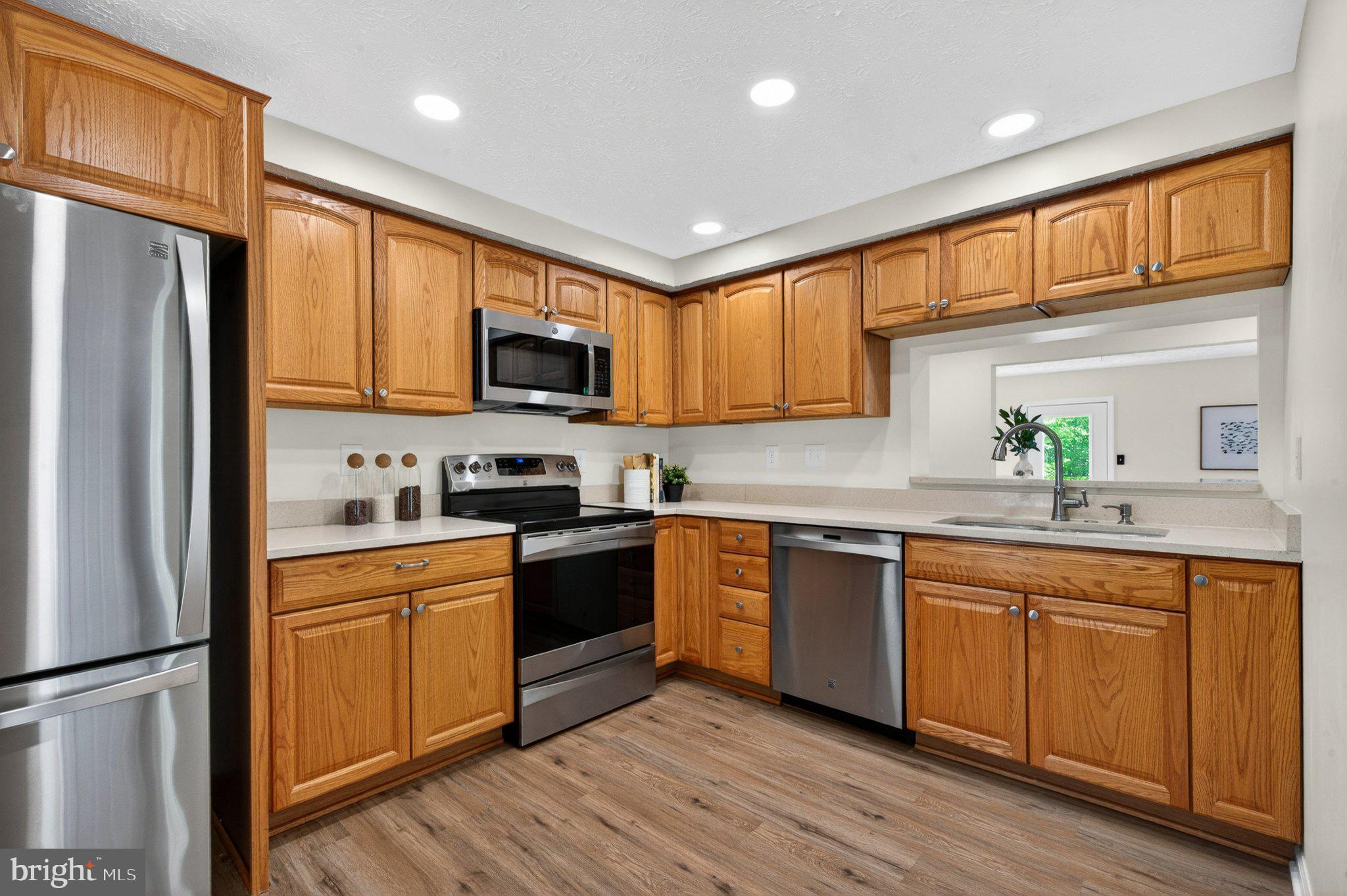 9129 Blarney Stone Drive Springfield, VA 22152 - Photo 4 of 34 Modern kitchen with warm wood tones.