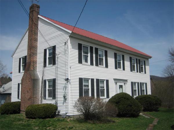 154 Long Plain Road Leverett, MA 01054 - Photo 1 of 16 a front view of a house with a garden