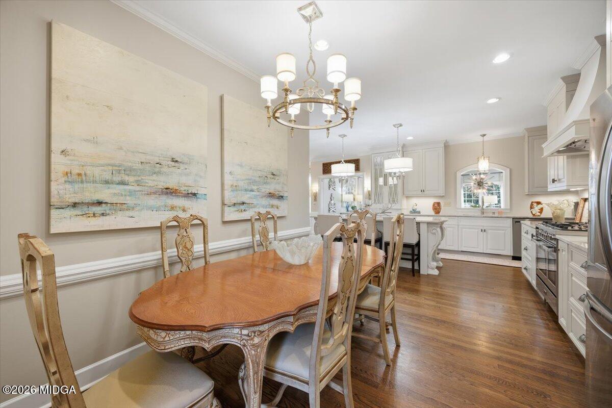 102 Merion Park Macon, GA 31210 - Photo 14 of 54 a view of a dining room with furniture a chandelier and wooden floor