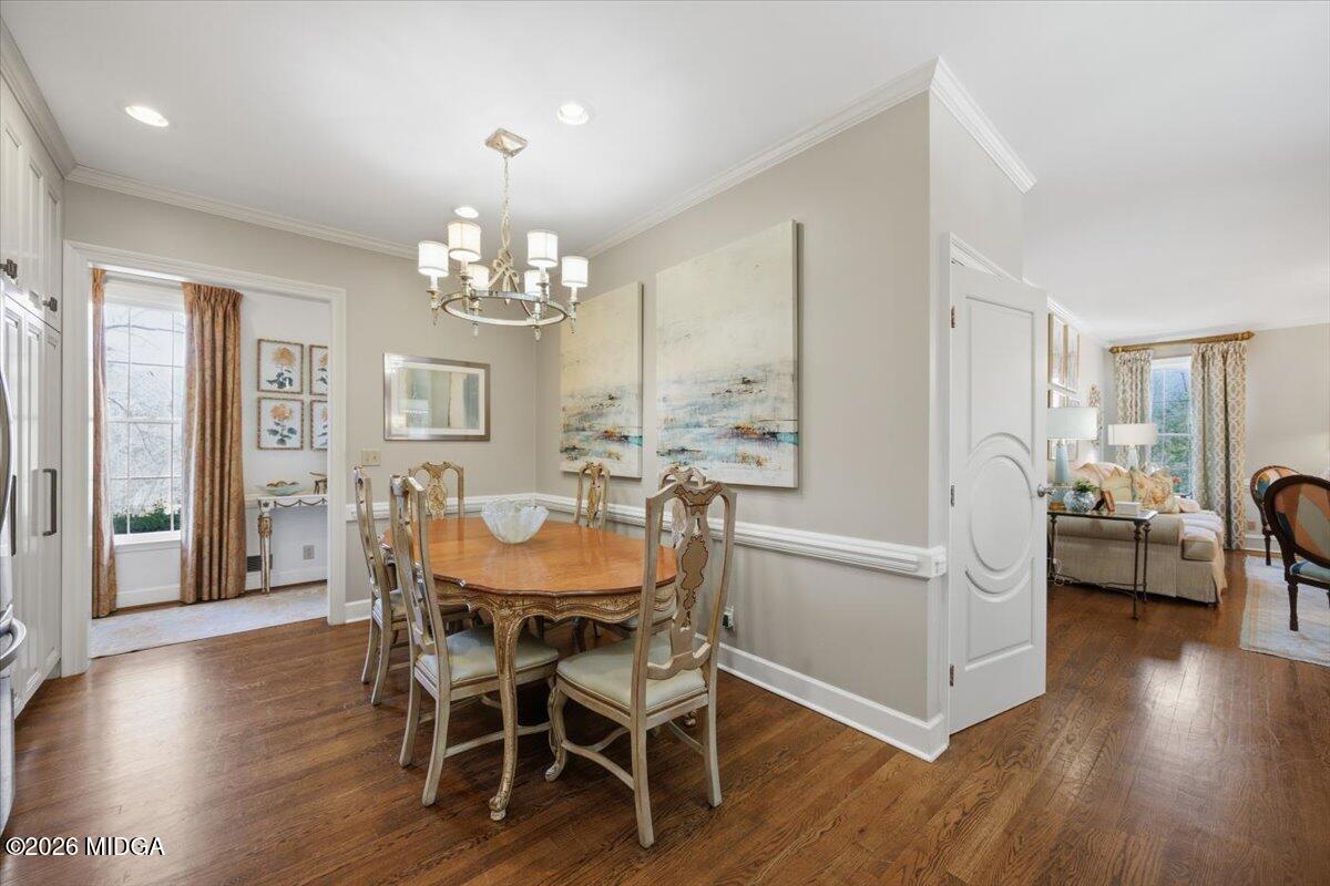 102 Merion Park Macon, GA 31210 - Photo 15 of 54 a dining room with furniture a chandelier and wooden floor