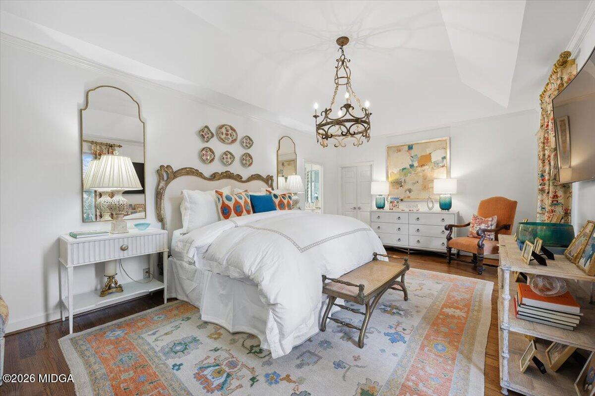 102 Merion Park Macon, GA 31210 - Photo 18 of 54 a bed room with a bed and a chandelier