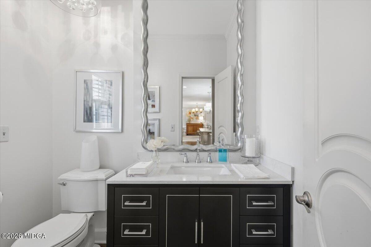 102 Merion Park Macon, GA 31210 - Photo 26 of 54 a bathroom with a granite countertop toilet sink and mirror