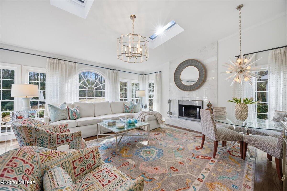 102 Merion Park Macon, GA 31210 - Photo 27 of 54 a living room with furniture a fireplace and a chandelier