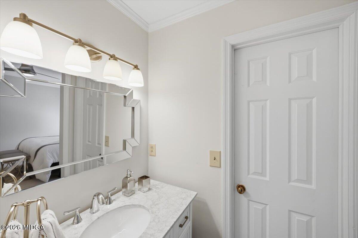 102 Merion Park Macon, GA 31210 - Photo 38 of 54 a bathroom with a granite countertop sink and a mirror