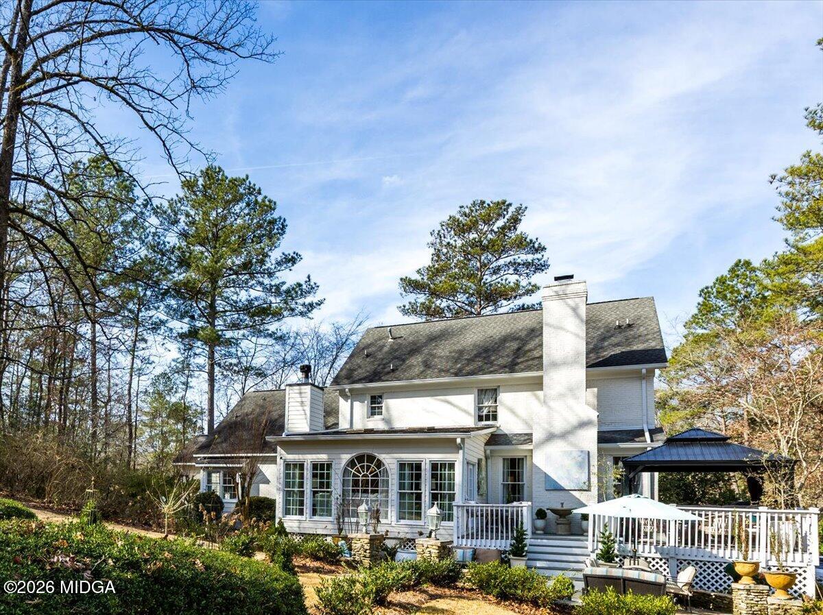 102 Merion Park Macon, GA 31210 - Photo 49 of 54 a front view of a building with glass top table and chairs