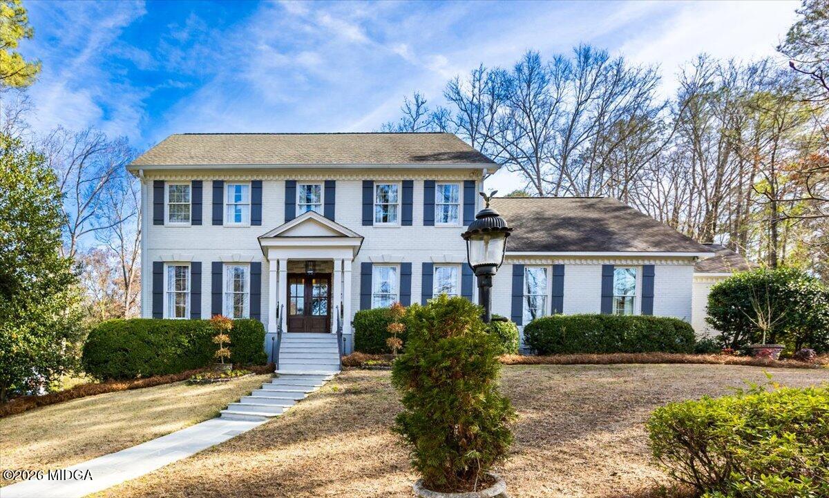 102 Merion Park Macon, GA 31210 - Photo 52 of 54 a front view of a house with yard and green space