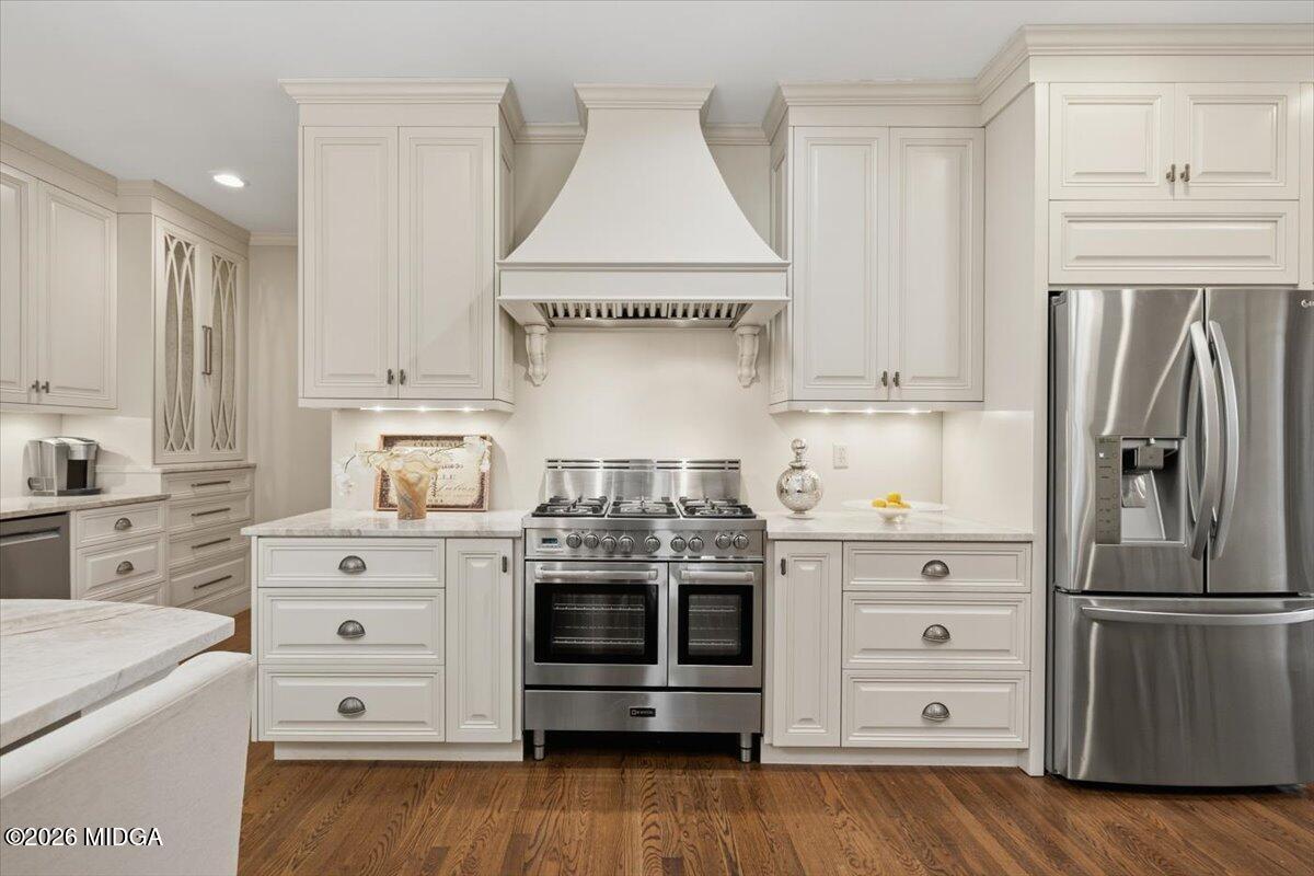 102 Merion Park Macon, GA 31210 - Photo 9 of 54 a kitchen with stainless steel appliances a stove and white cabinets