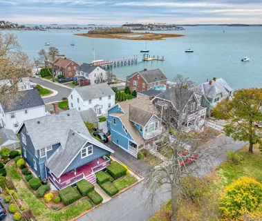 a view of a house with a yard and plants