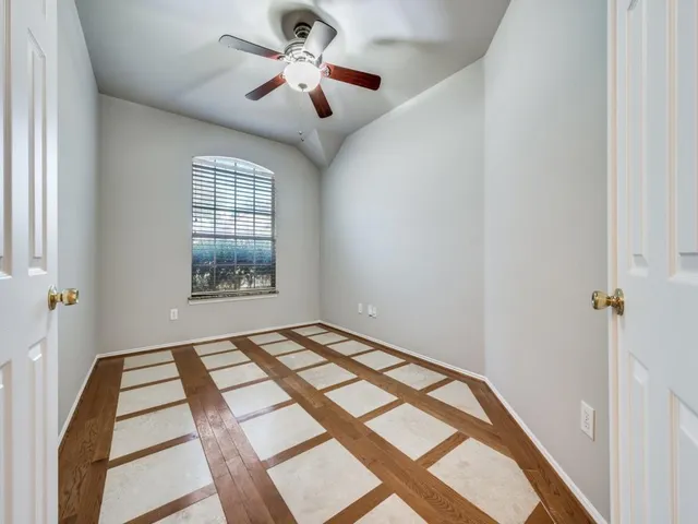 a view of an empty room with a window