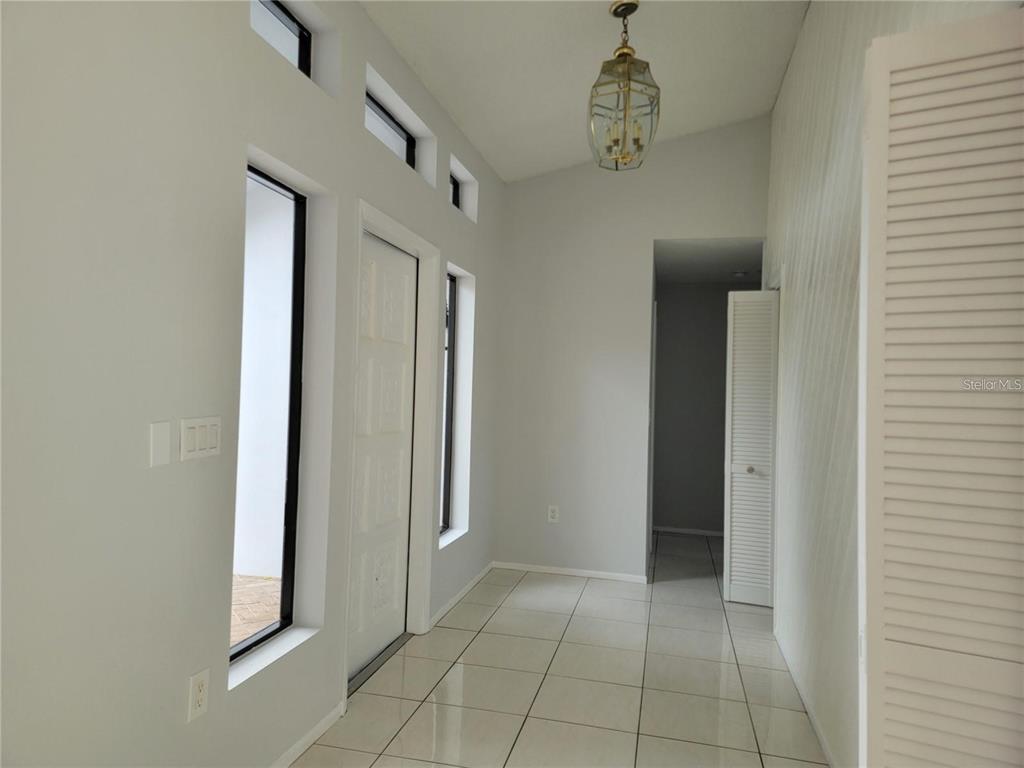 26221 Constantine Road Punta Gorda, FL 33983 - Photo 7 of 27 a view of a hallway to rooms