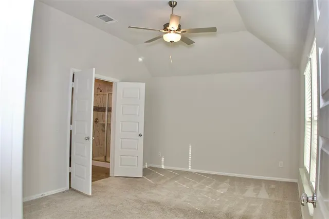 a bathroom with a glass shower door