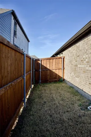 a view of a swimming pool with a yard
