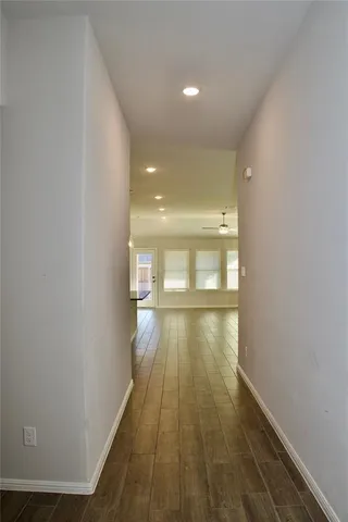 a dining area with furniture and a kitchen view
