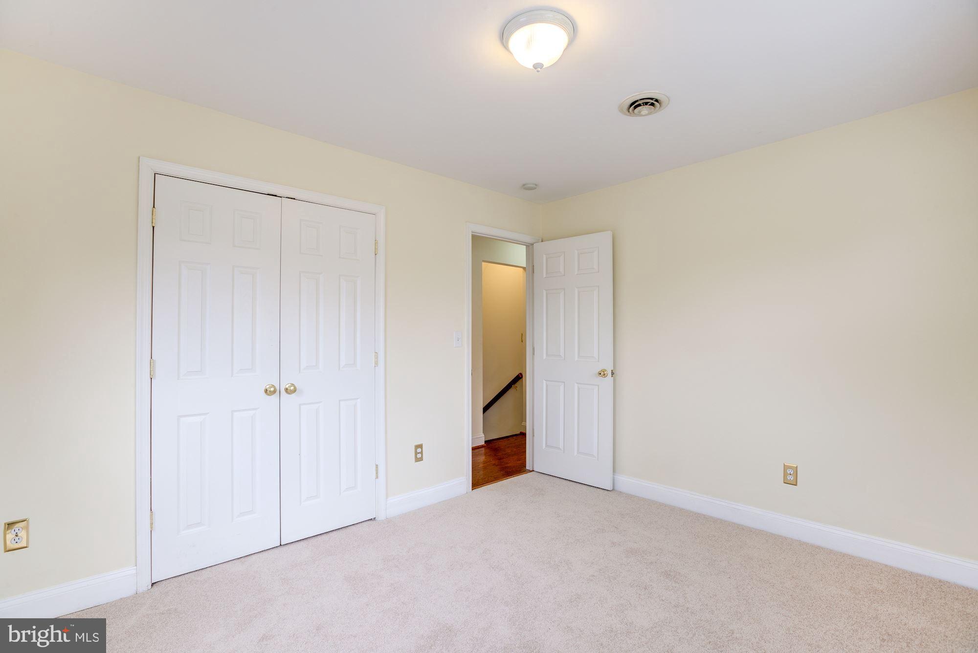 8203 Frye Road Alexandria, VA 22309 - Photo 13 of 34 Upstairs first bedroom with closet