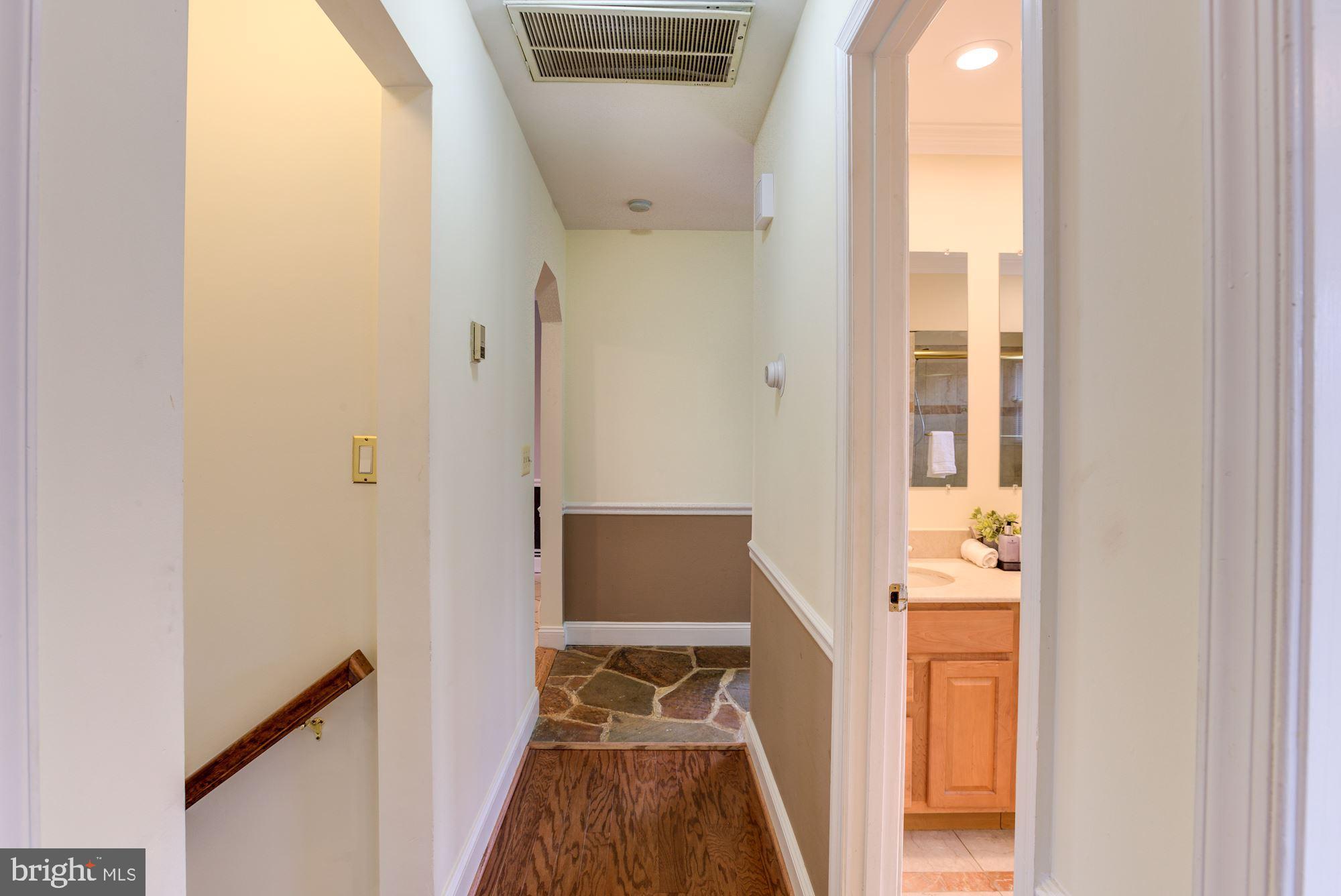 8203 Frye Road Alexandria, VA 22309 - Photo 17 of 34 Upstairs hall to lower level and bathroom