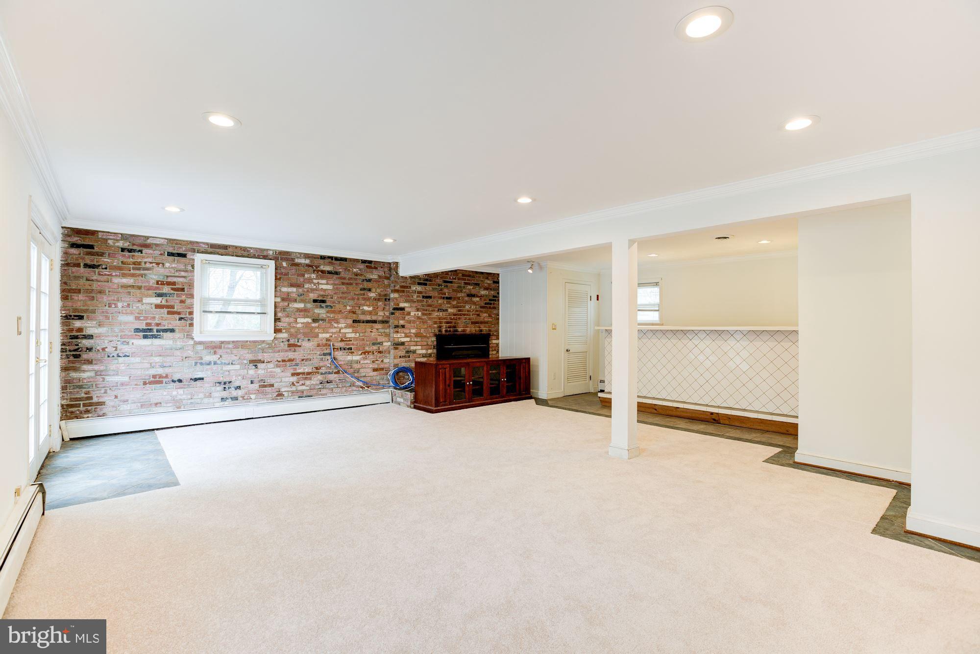 8203 Frye Road Alexandria, VA 22309 - Photo 18 of 34 Family room with fireplace.