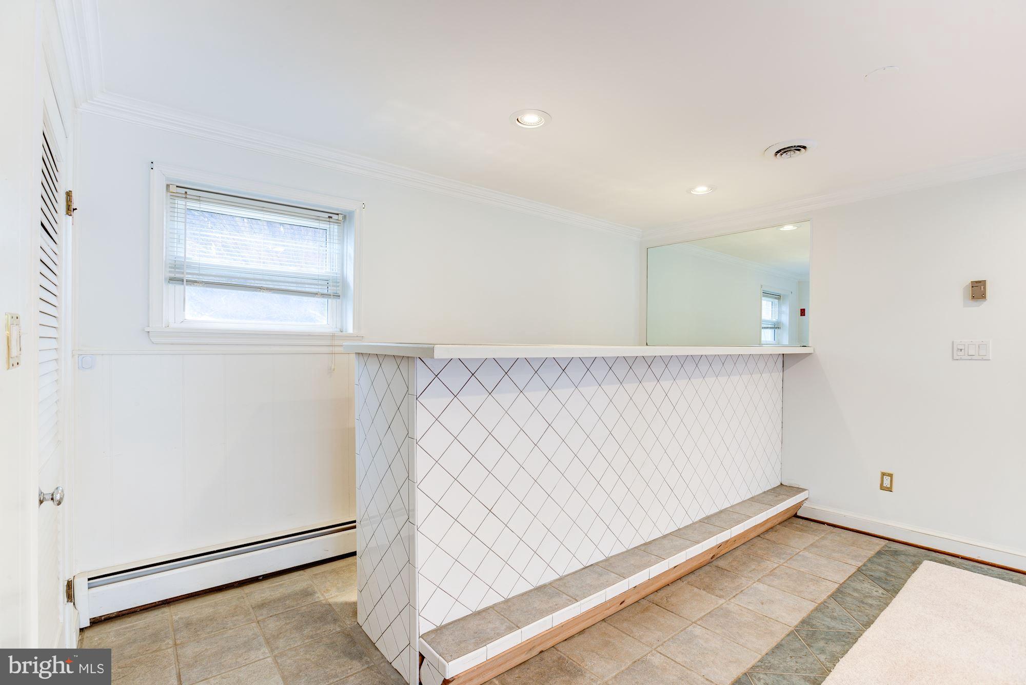8203 Frye Road Alexandria, VA 22309 - Photo 20 of 34 Tiled bar in family room.