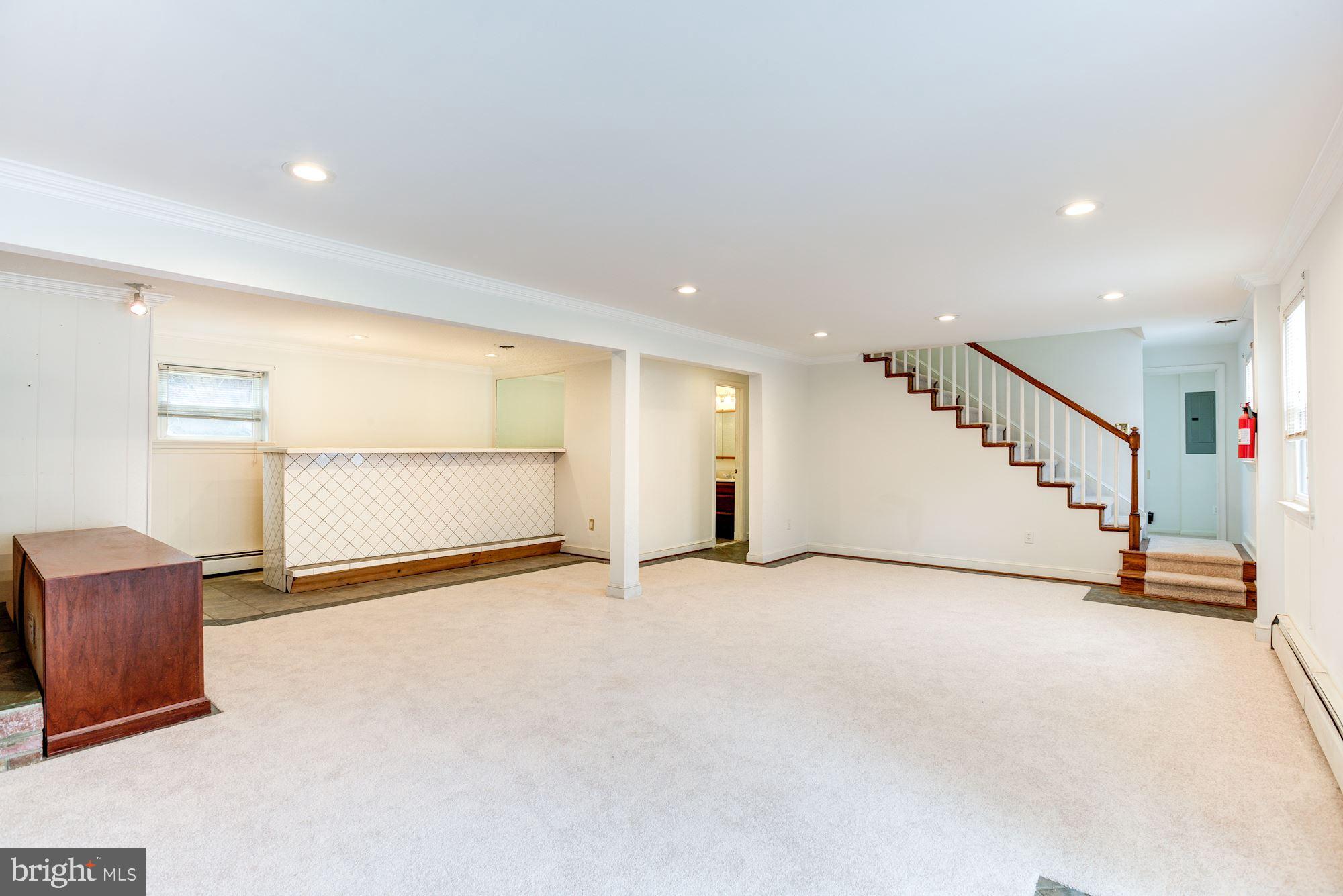 8203 Frye Road Alexandria, VA 22309 - Photo 21 of 34 Family room with stairs to upper level.