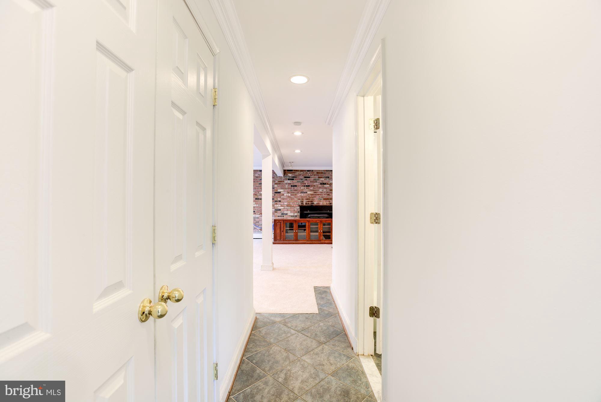 8203 Frye Road Alexandria, VA 22309 - Photo 28 of 34 Downstairs hall leading towards family room