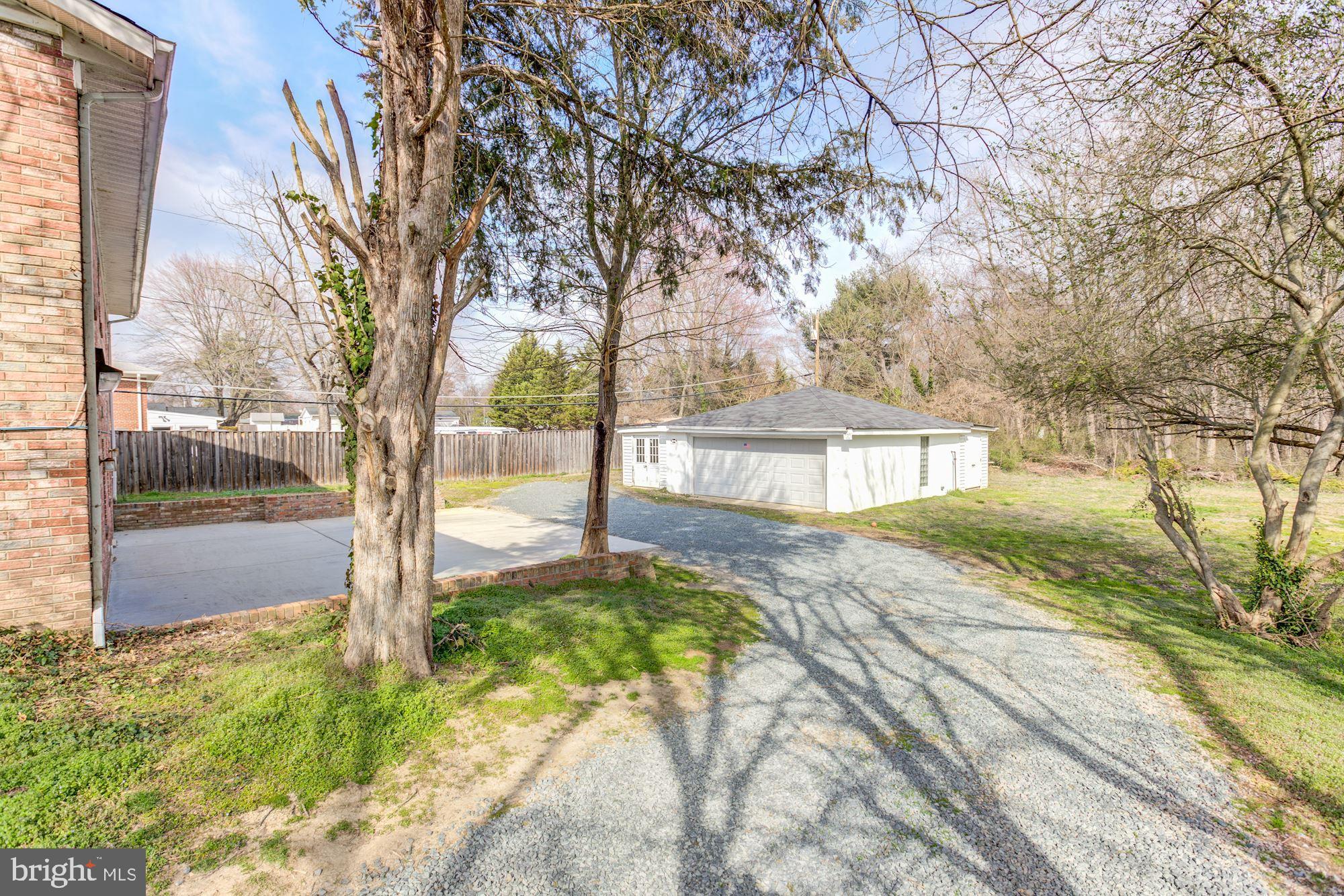 8203 Frye Road Alexandria, VA 22309 - Photo 32 of 34 Side driveway leading to detached garage.