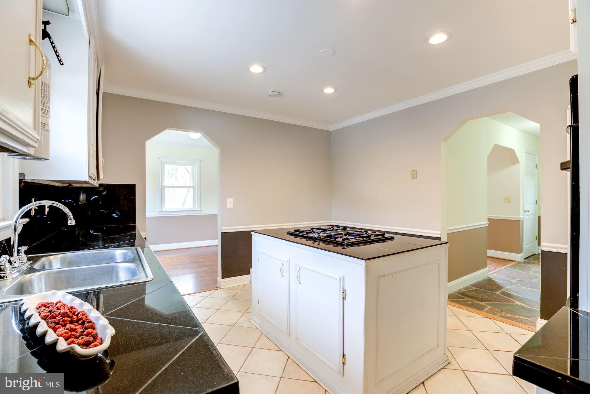 8203 Frye Road Alexandria, VA 22309 - Photo 7 of 34 Kitchen center island with cooktop.