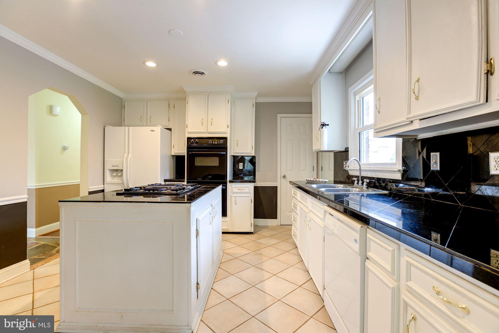 8203 Frye Road Alexandria, VA 22309 - Photo 9 of 34 White and bright kitchen!