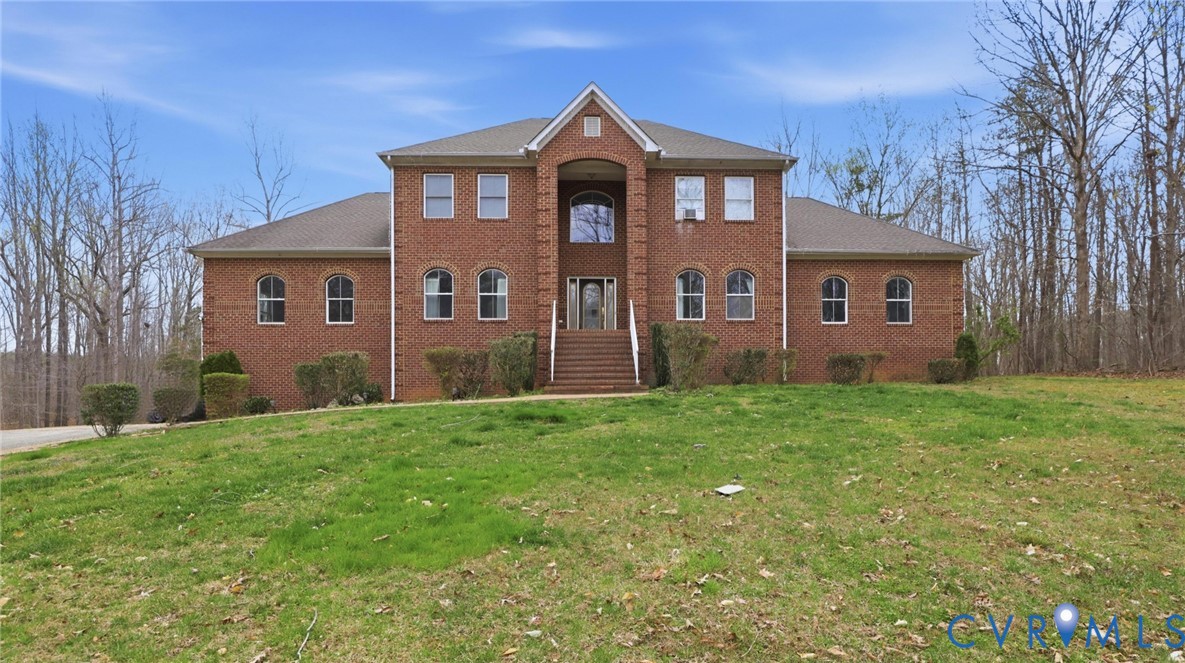 4510 Bell Road Powhatan, VA 23139 - Photo 1 of 12 a front view of a house with yard