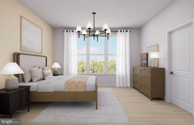 a living room with couches and chandelier