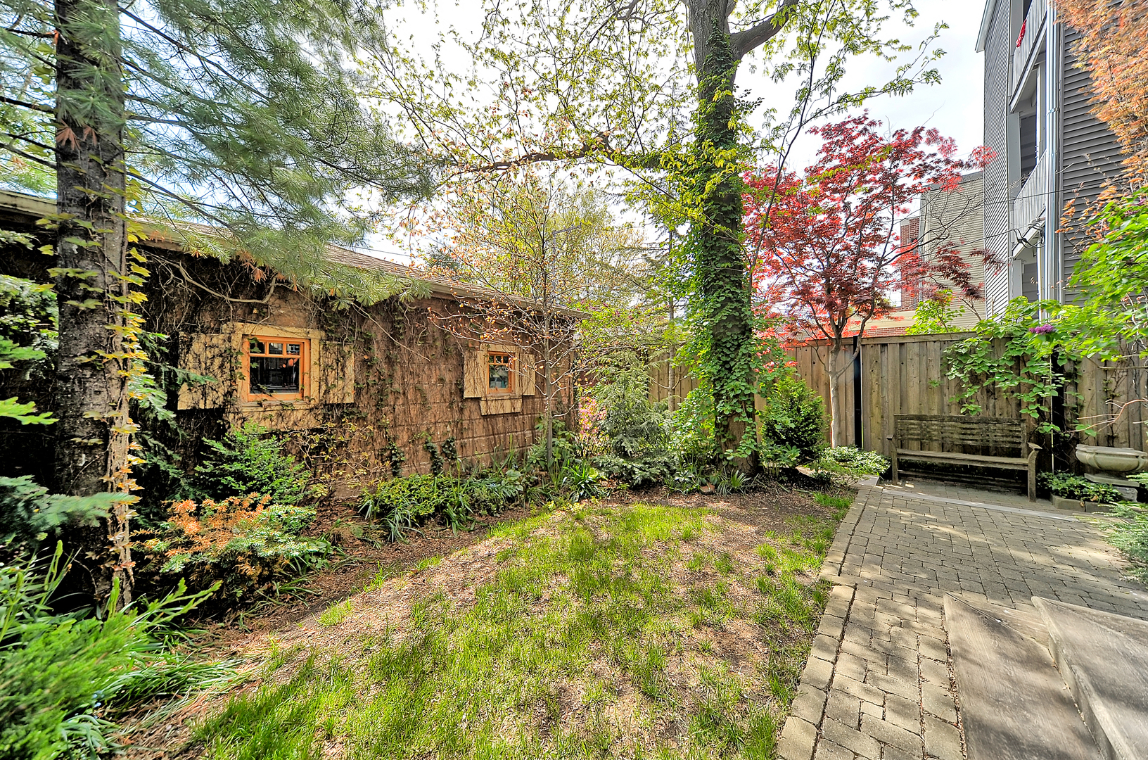 3729 North Wayne Avenue, Unit 2 Chicago, IL 60613 - Photo 17 of 17 a backyard of a house with table and chairs