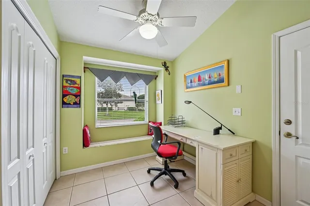 a utility room with dryer and cars