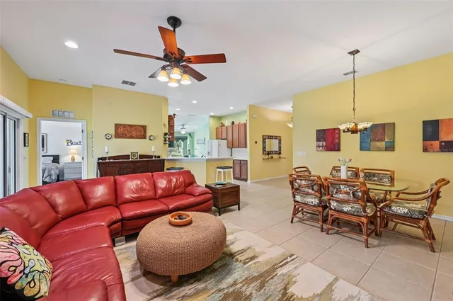 a view of kitchen island with stainless steel appliances kitchen island granite countertop a sink and cabinets