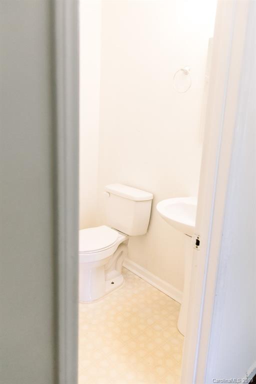 10154 Woody Ridge Road Charlotte, NC 28273 - Photo 5 of 9 a bathroom with a toilet and a shower
