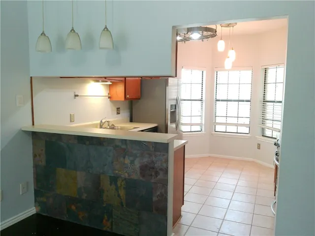 a bathroom with a sink vanity and a mirror