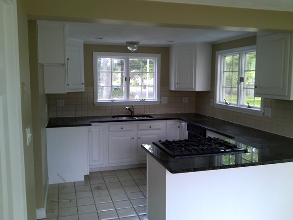 23 Hawthorne Road Holbrook, MA 02343 - Photo 5 of 13 a kitchen with granite countertop a sink a stove and cabinets