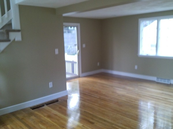 23 Hawthorne Road Holbrook, MA 02343 - Photo 8 of 13 a view of empty room with wooden floor and fan