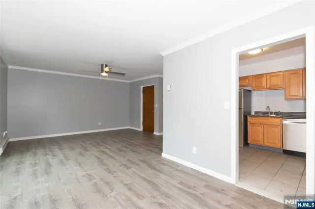 a view of a kitchen with a sink and a stove top oven
